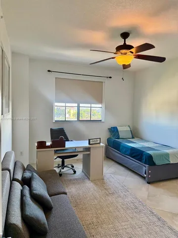 a bathroom with a sink vanity and mirror