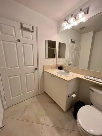 a bathroom with a shower and a toilet