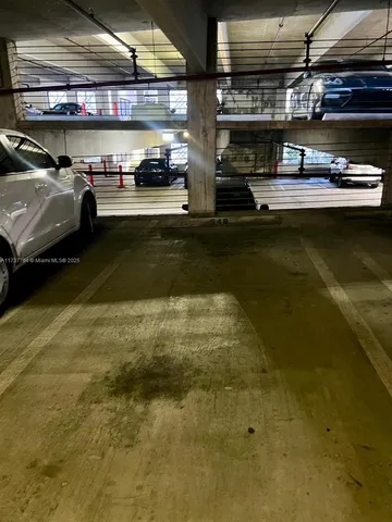 a view of a patio with lawn chairs