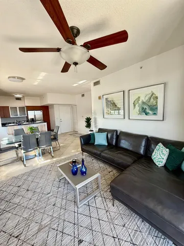 a living room with furniture and a table