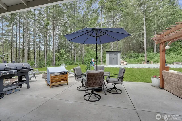a view of backyard with seating space and hardwood floor