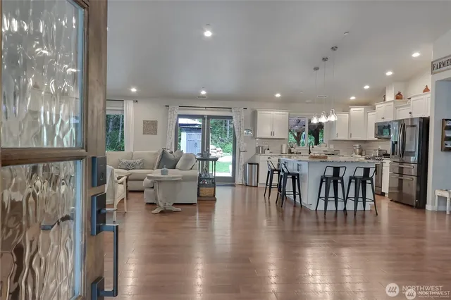 a view of a dining room with furniture window and wooden floor