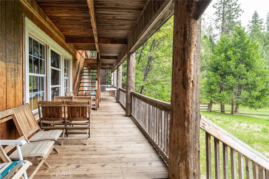 5657 Worman Road Ahwahnee, CA 93601 - Photo 12 of 46 a view of a porch with furniture and a yard