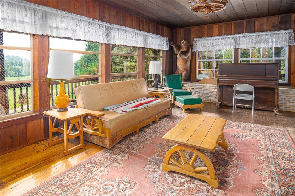 5657 Worman Road Ahwahnee, CA 93601 - Photo 14 of 46 a living room with furniture and a large window