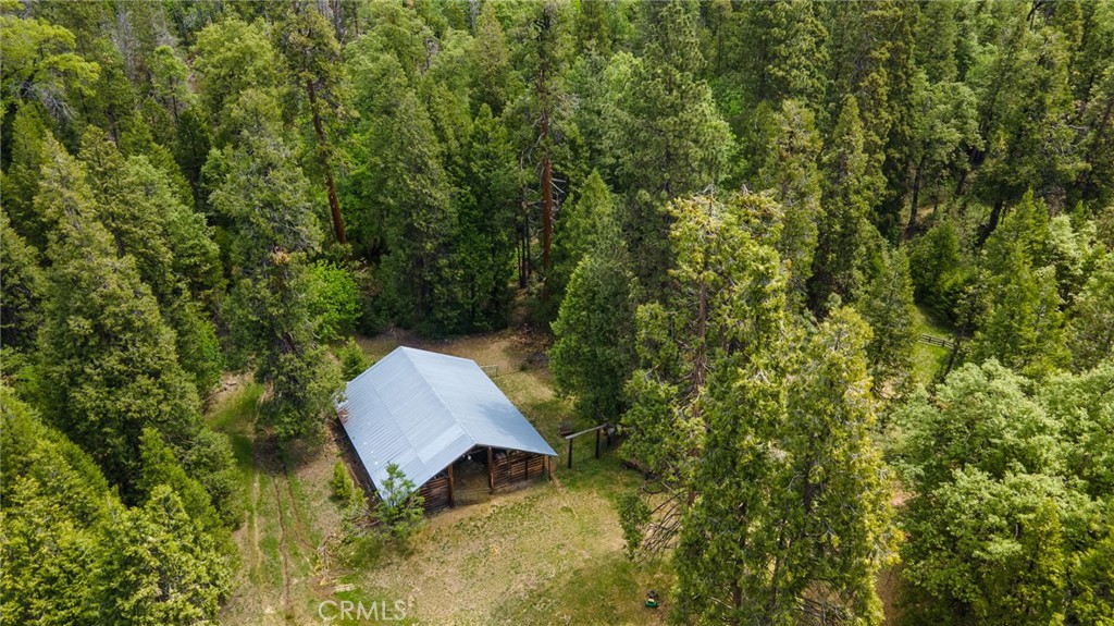 5657 Worman Road Ahwahnee, CA 93601 - Photo 24 of 40 a backyard of a house with yard and outdoor seating