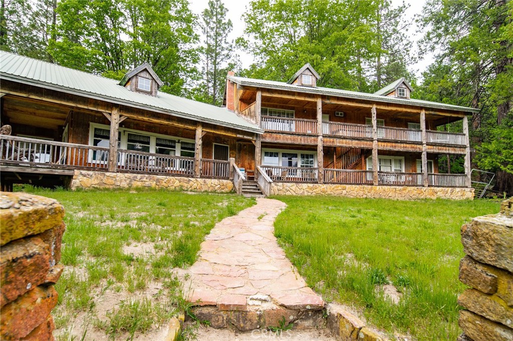 5657 Worman Road Ahwahnee, CA 93601 - Photo 26 of 46 a view of a house with a yard patio and swimming pool