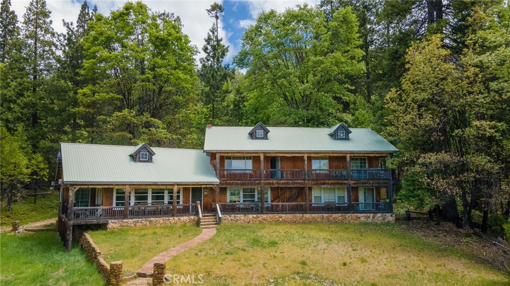 5657 Worman Road Ahwahnee, CA 93601 - Photo 27 of 46 front view of a house with a yard
