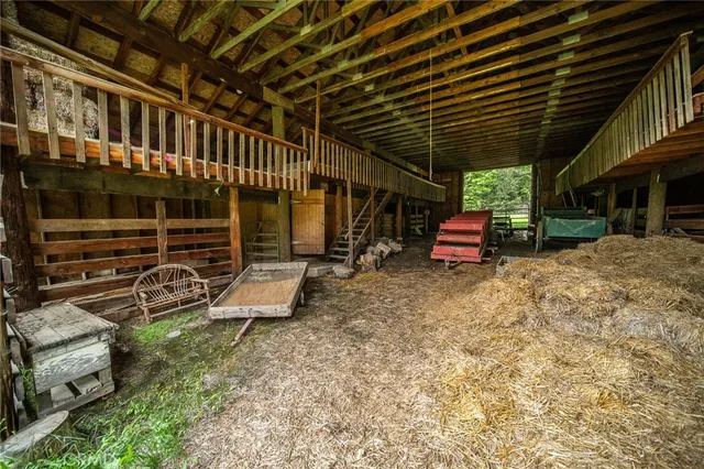 a view of outdoor space with green field and trees all around