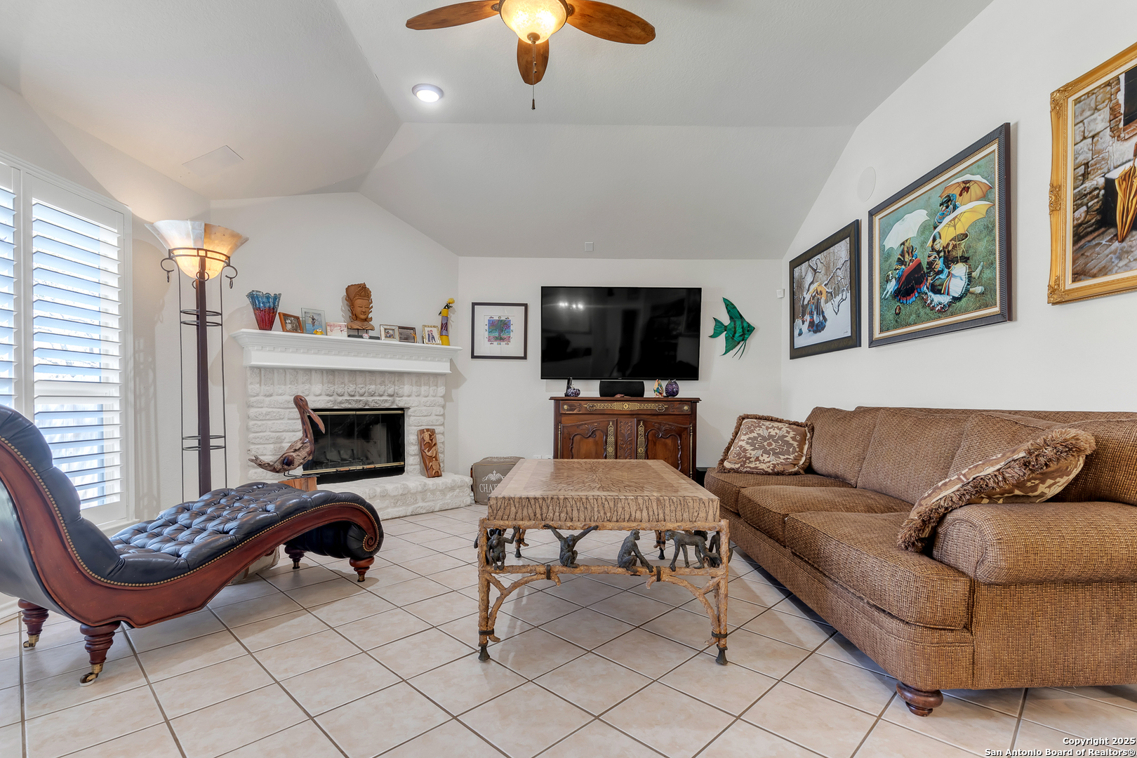 1735 Diamond Ridge San Antonio, TX 78248 - Photo 18 of 33 a living room with furniture a fireplace and a flat screen tv