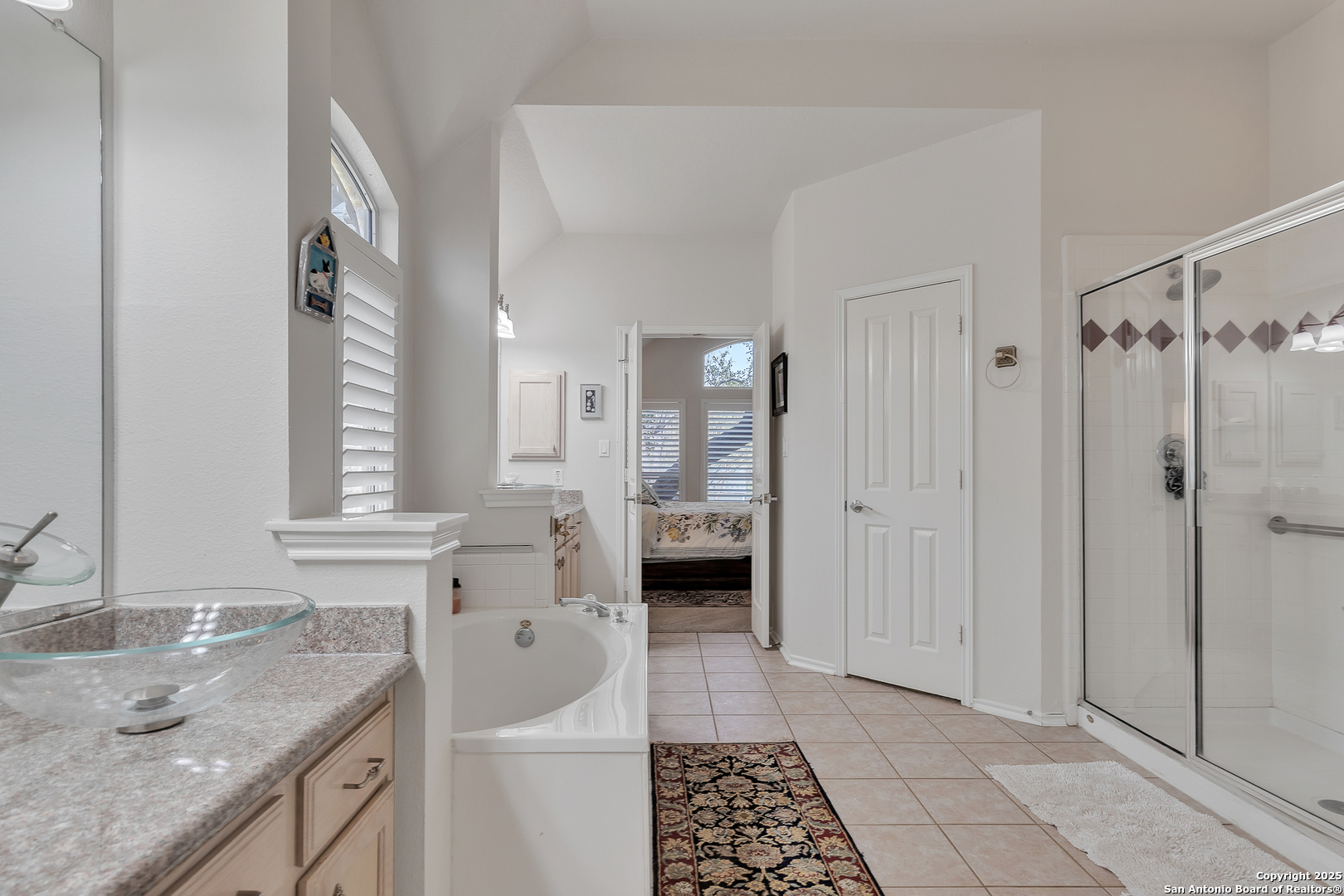 1735 Diamond Ridge San Antonio, TX 78248 - Photo 22 of 33 a bathroom with a granite countertop sink a mirror and a shower