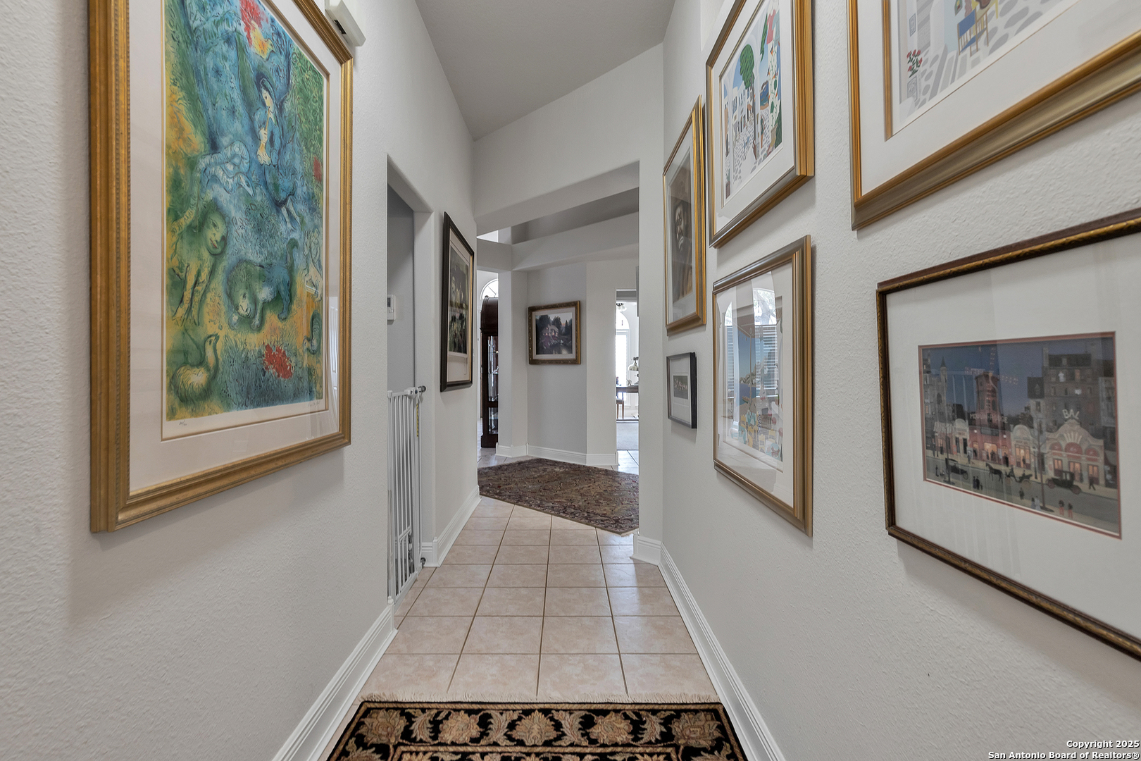 1735 Diamond Ridge San Antonio, TX 78248 - Photo 9 of 33 a hallway with painting on the wall and a large window