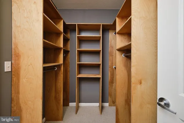a view of an empty walk in closet