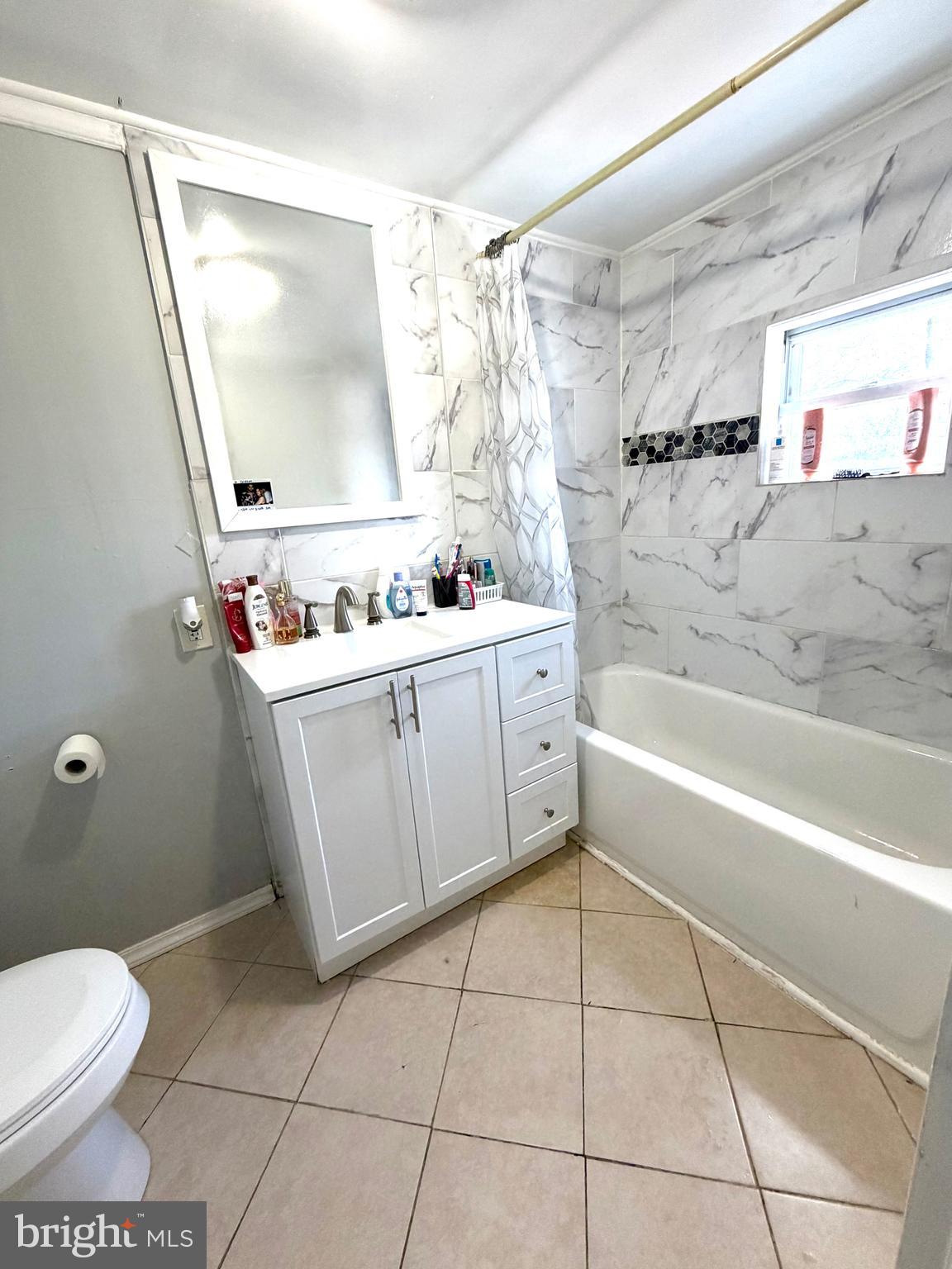 526 South 11th Street Reading, PA 19602 - Photo 13 of 22 a bathroom with a sink a toilet and shower