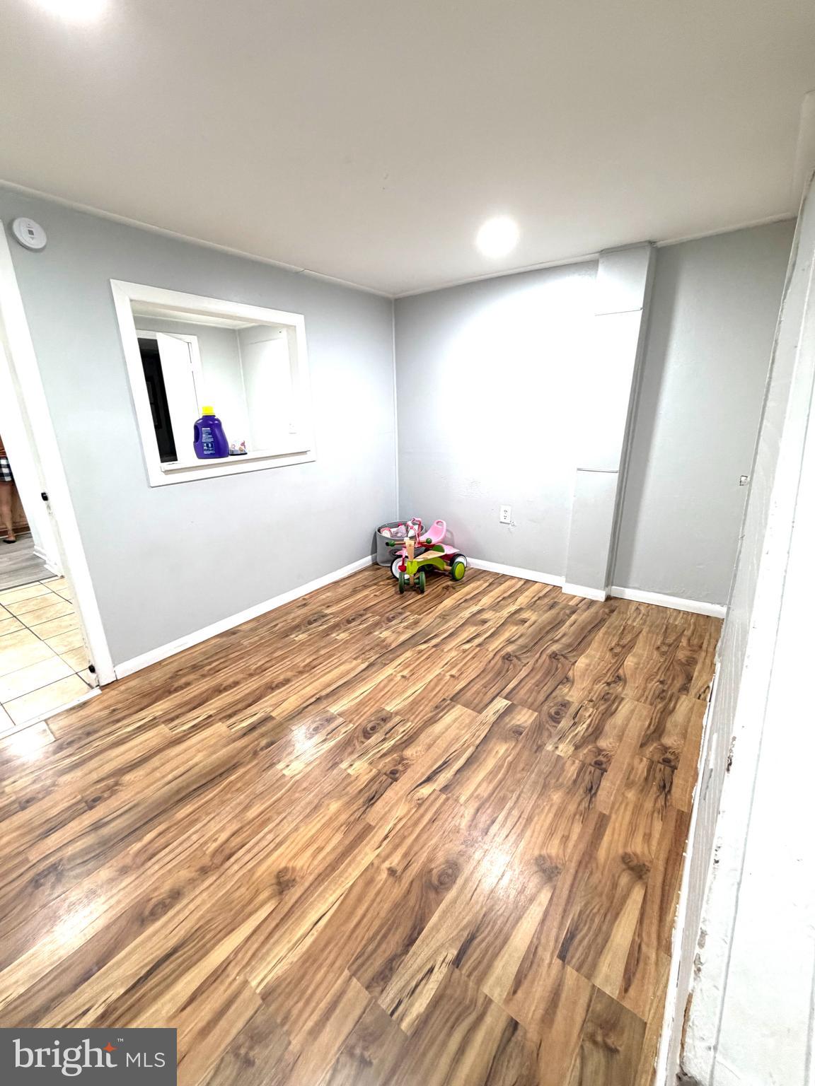 526 South 11th Street Reading, PA 19602 - Photo 4 of 22 a bedroom with a bed and a window