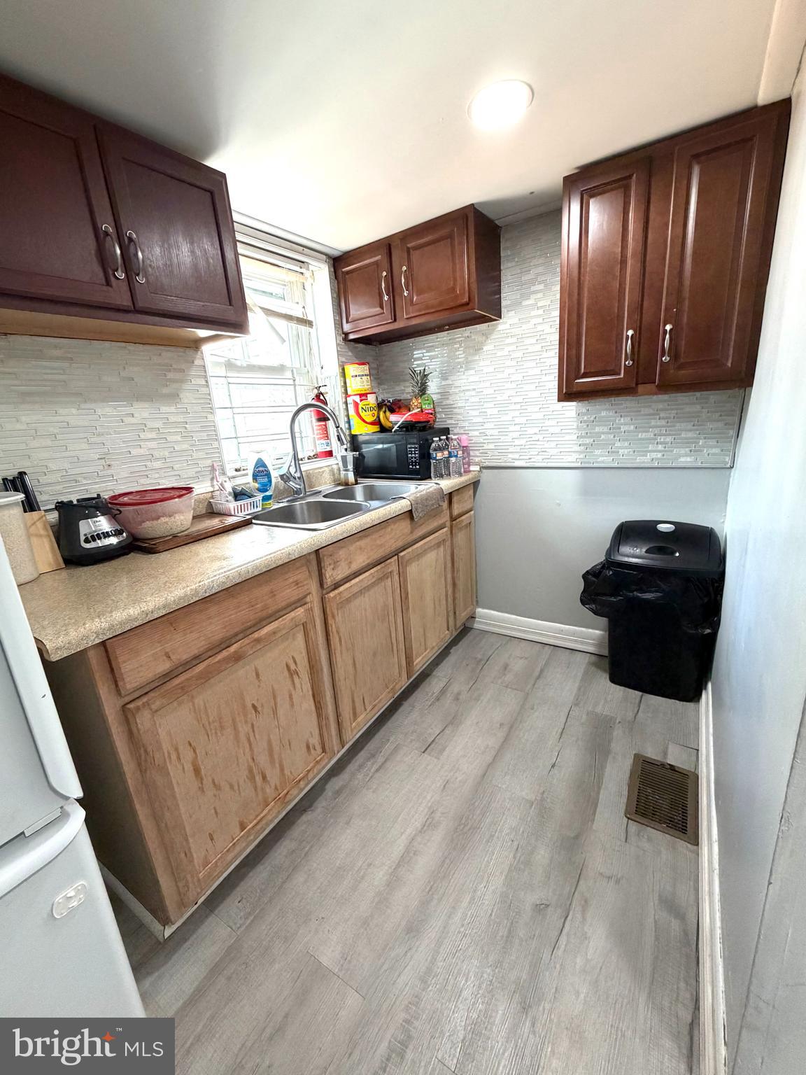526 South 11th Street Reading, PA 19602 - Photo 9 of 22 a kitchen with a sink a stove and cabinets
