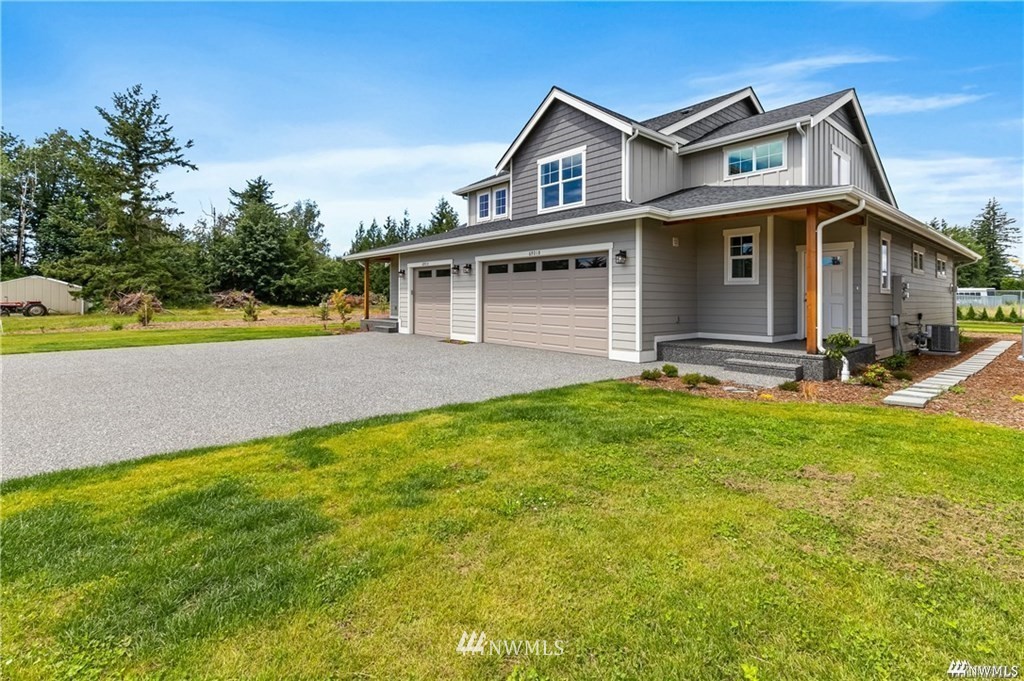 6902 Red Ridge Drive, Unit A Lynden, WA 98264 - Photo 2 of 31 a front view of a house with a yard