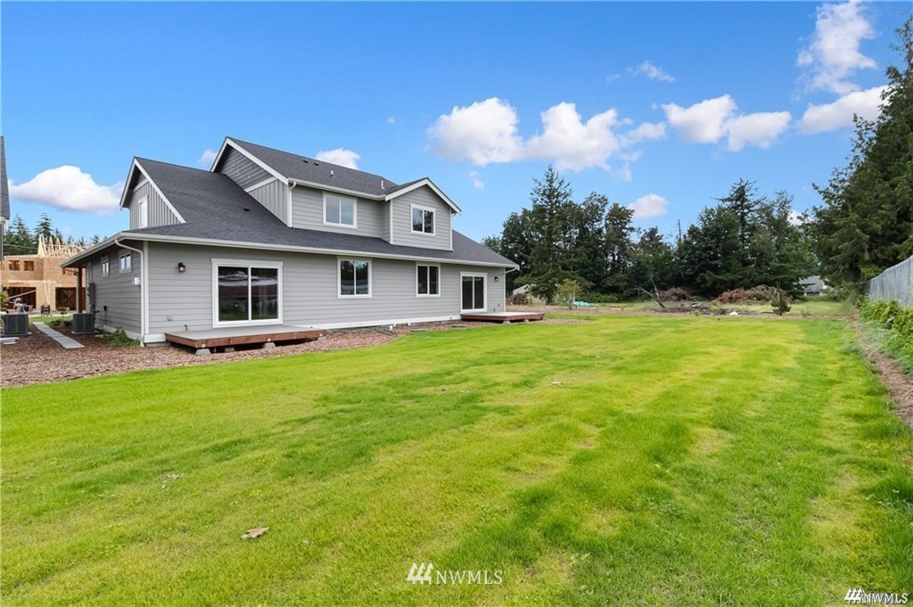 6902 Red Ridge Drive, Unit A Lynden, WA 98264 - Photo 30 of 31 a front view of a house with garden