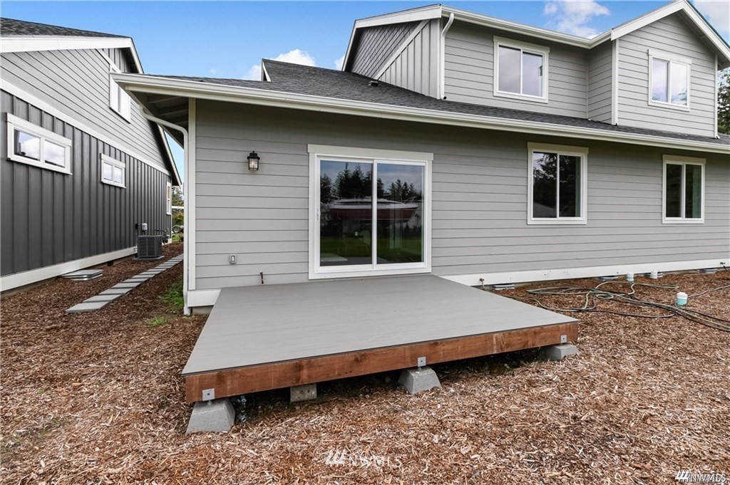 6902 Red Ridge Drive, Unit A Lynden, WA 98264 - Photo 31 of 31 a front view of a house with a garden