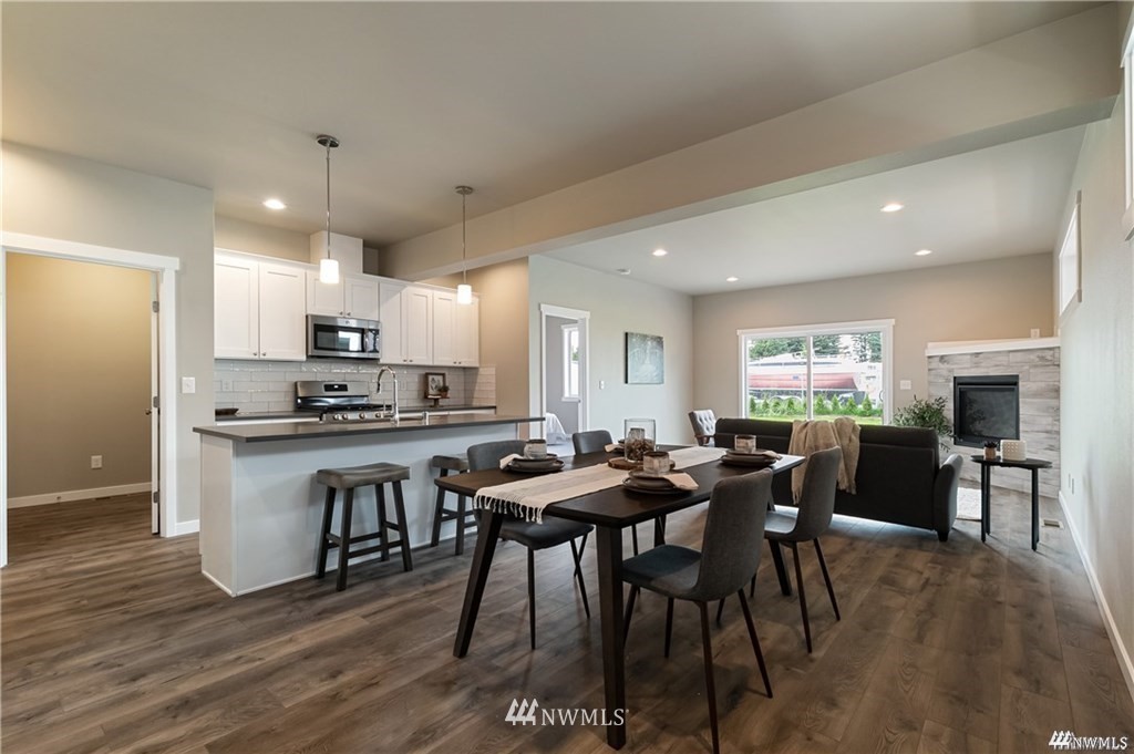 6902 Red Ridge Drive, Unit A Lynden, WA 98264 - Photo 5 of 31 a view of a dining room with furniture and wooden floor
