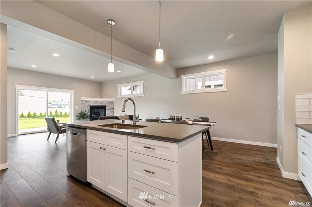6902 Red Ridge Drive, Unit A Lynden, WA 98264 - Photo 10 of 31 a kitchen with white cabinets and sink