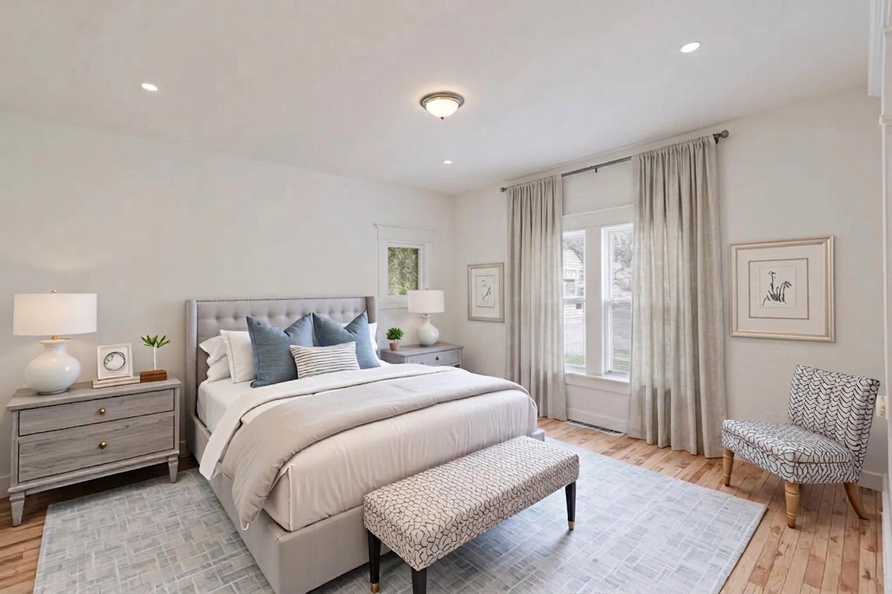 306 Brown Street Valparaiso, IN 46383 - Photo 12 of 19 a spacious bedroom with a bed and wooden floor