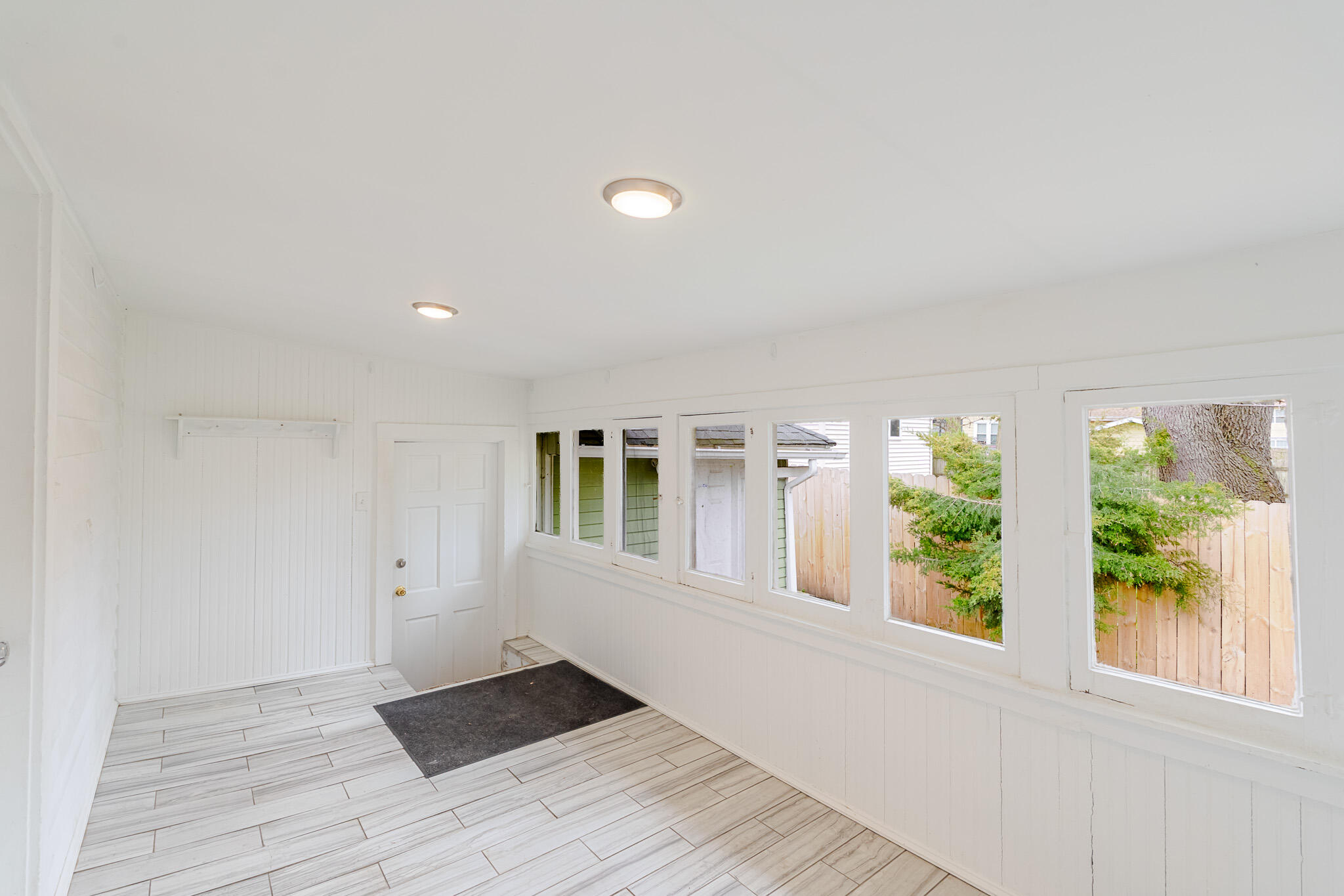 306 Brown Street Valparaiso, IN 46383 - Photo 16 of 19 wooden floor in an empty room with a window
