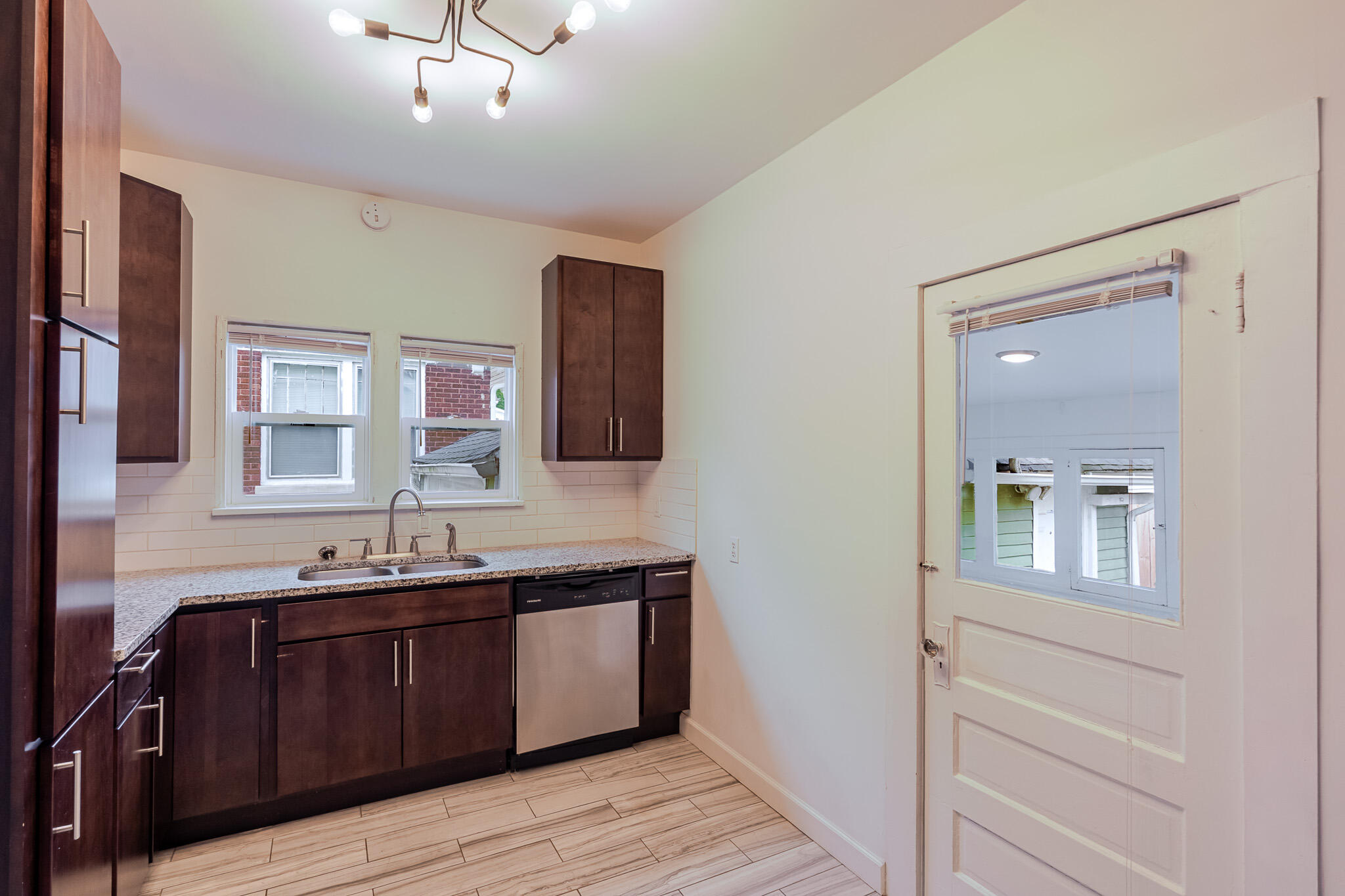 306 Brown Street Valparaiso, IN 46383 - Photo 9 of 19 a bathroom with a double vanity sink and a mirror