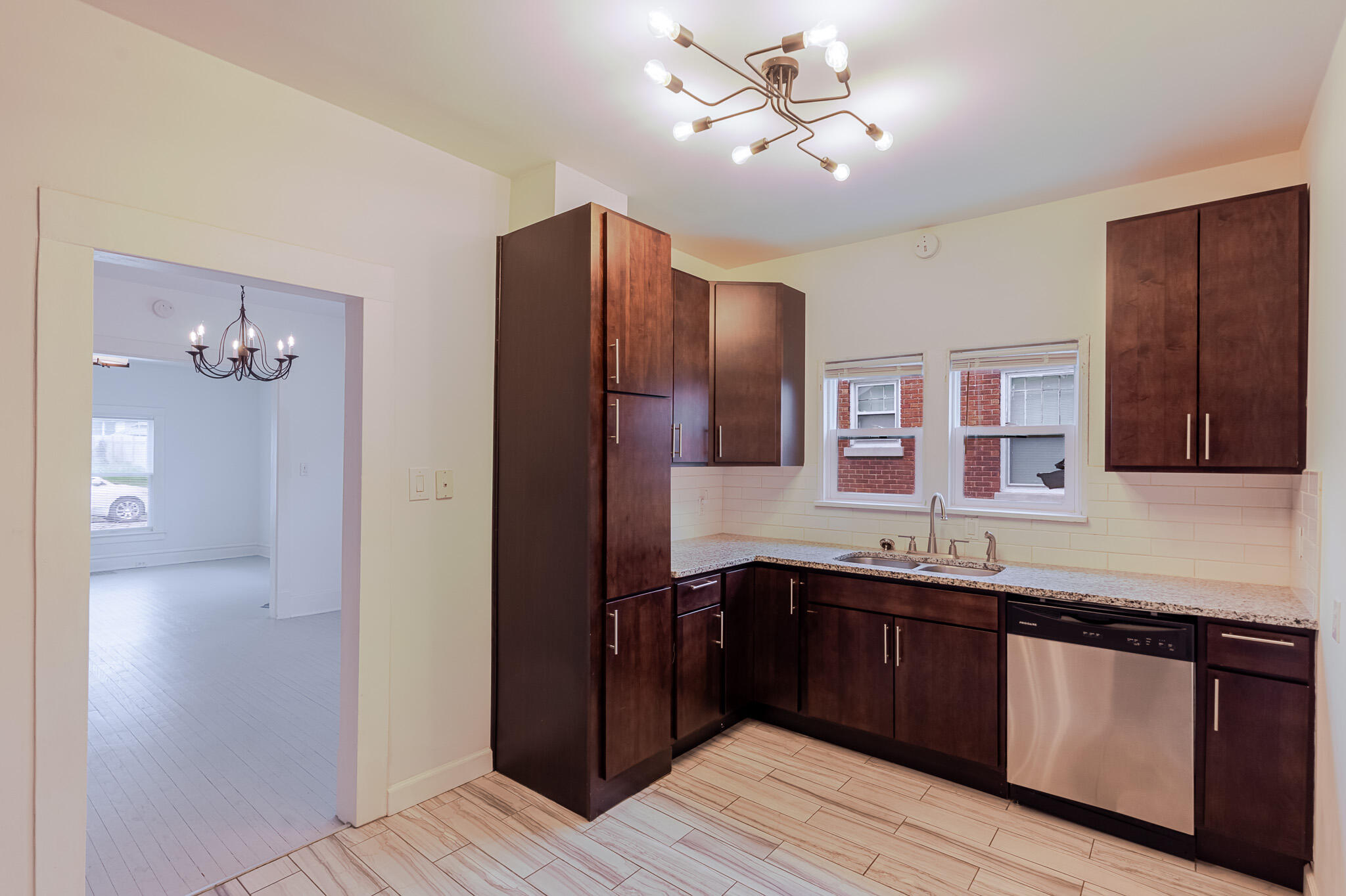 306 Brown Street Valparaiso, IN 46383 - Photo 10 of 19 a kitchen with a sink and refrigerator