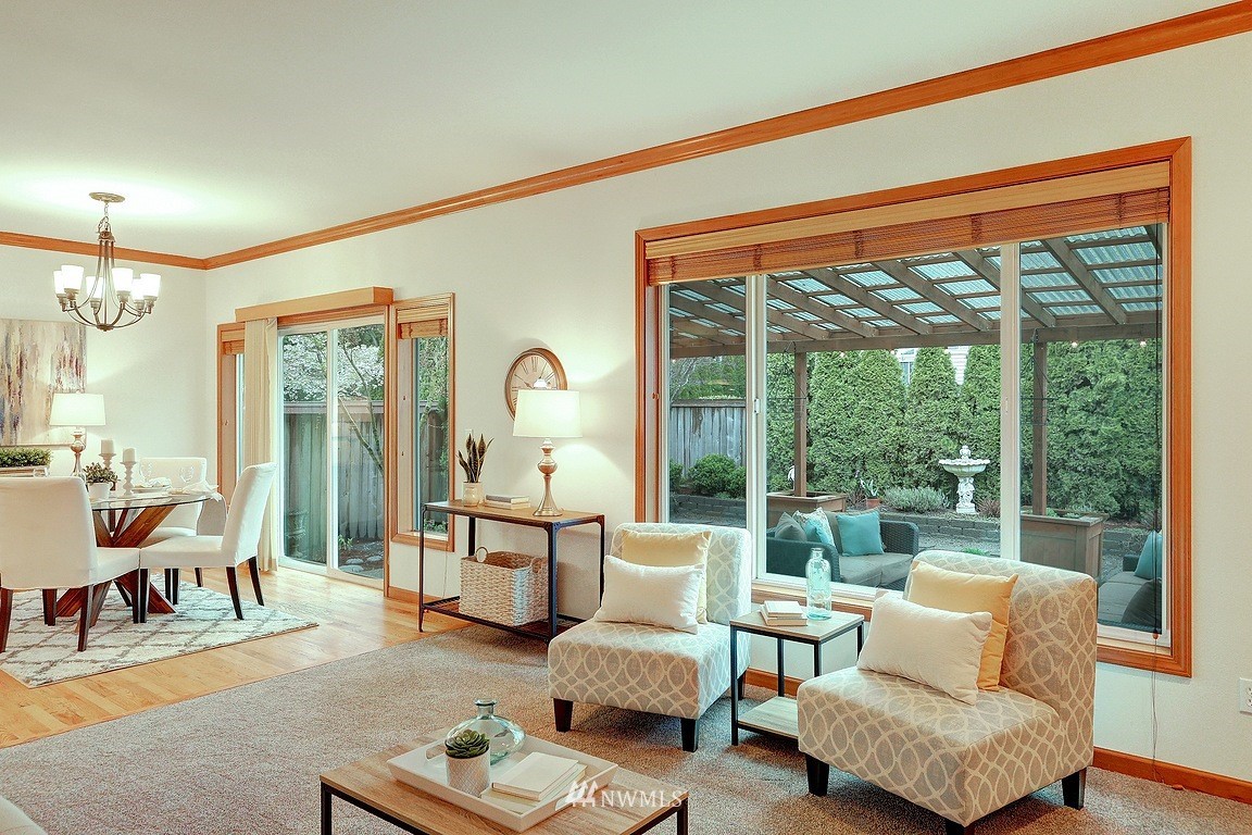 105 182nd Place Southwest, Unit B Bothell, WA 98012 - Photo 12 of 25 a living room with furniture and a large window