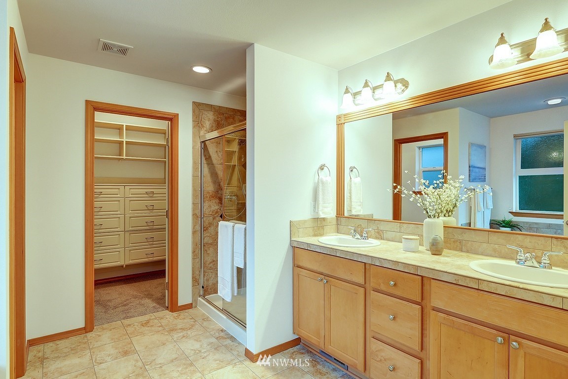 105 182nd Place Southwest, Unit B Bothell, WA 98012 - Photo 16 of 25 a bathroom with a granite countertop sink and a mirror