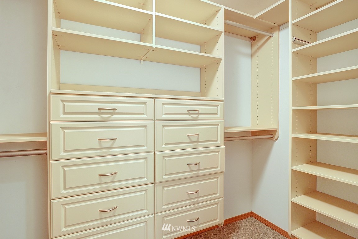 105 182nd Place Southwest, Unit B Bothell, WA 98012 - Photo 17 of 25 a view of walk in closet with empty racks