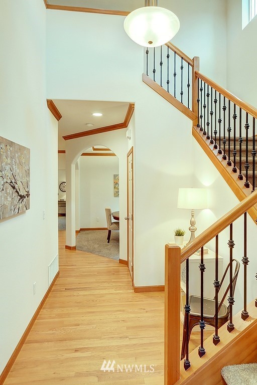 105 182nd Place Southwest, Unit B Bothell, WA 98012 - Photo 2 of 25 a view of a hallway with wooden floor and staircase