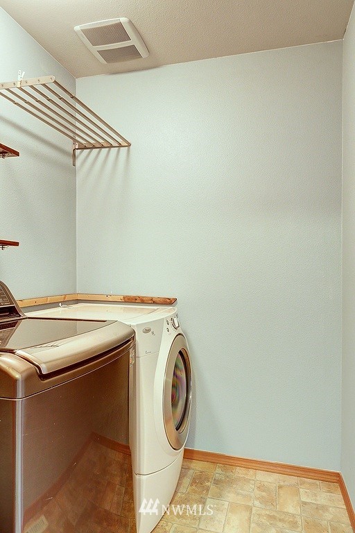 105 182nd Place Southwest, Unit B Bothell, WA 98012 - Photo 21 of 25 a utility room with dryer and washer