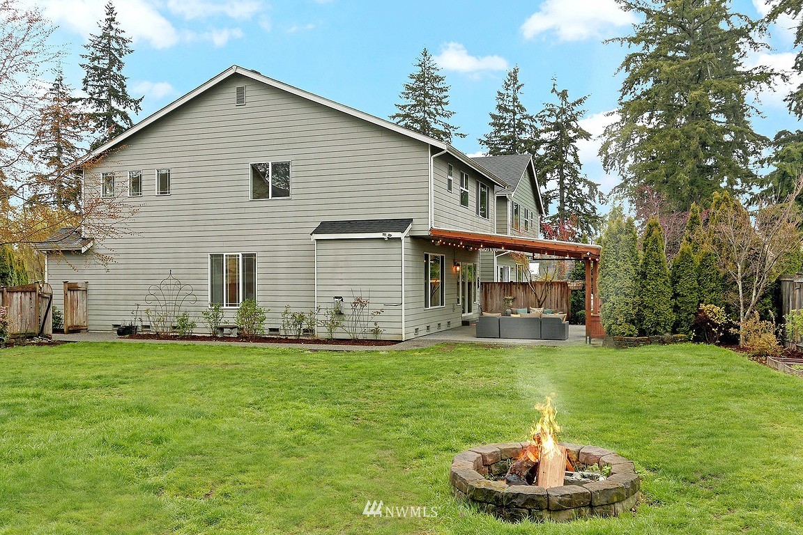 105 182nd Place Southwest, Unit B Bothell, WA 98012 - Photo 24 of 25 a front view of a house with a yard