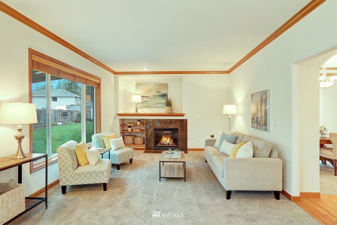 105 182nd Place Southwest, Unit B Bothell, WA 98012 - Photo 10 of 25 a living room with furniture and a fireplace