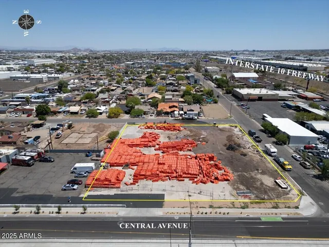an aerial view of residential building and car parked on street side