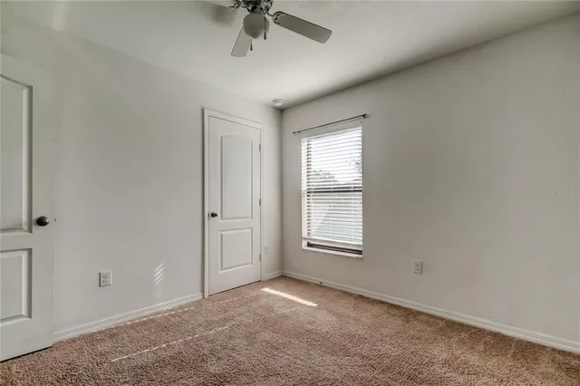 an empty room with a empty space and windows