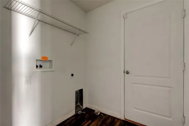 a view of a living room with a floor to ceiling window and an umbrella