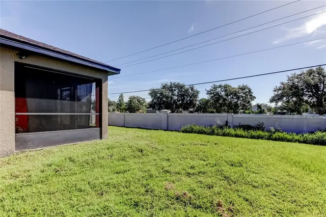 a view of a house with backyard and garden