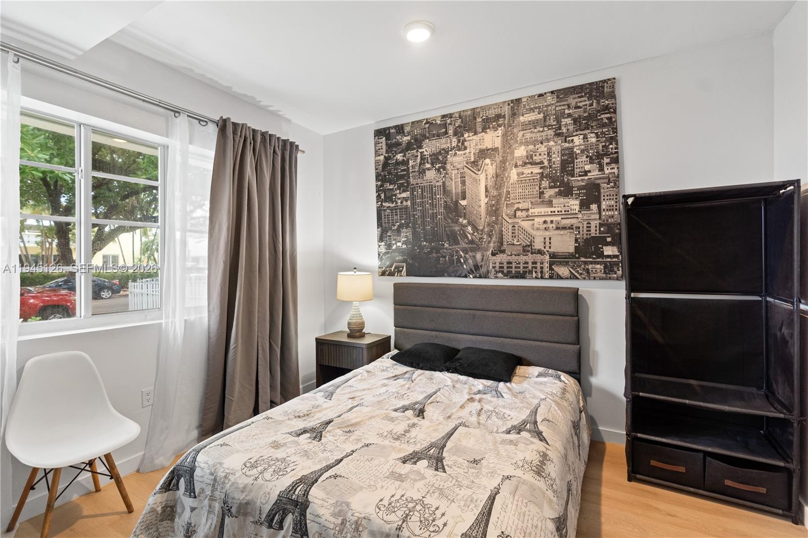 810 7th Street, Unit 102 Miami Beach, FL 33139 - Photo 12 of 21 a bedroom with a bed and a window