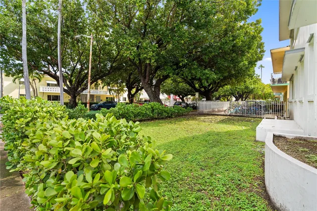 a garden view with a fountain