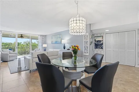 a kitchen with a sink stainless steel appliances and white cabinets