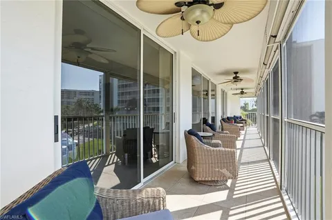 a view of balcony with furniture