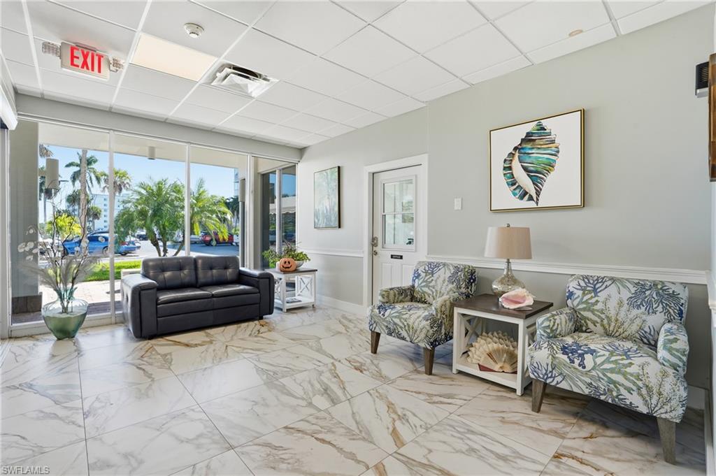 5 Bluebill Avenue, Unit 301 Naples, FL 34108 - Photo 33 of 48 a living room with furniture and a couch