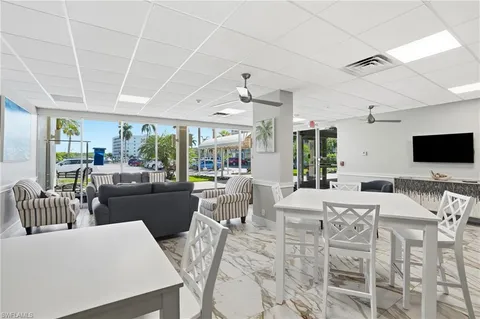 a bed room with a bed and a television