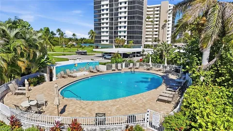 a view of a swimming pool with a patio
