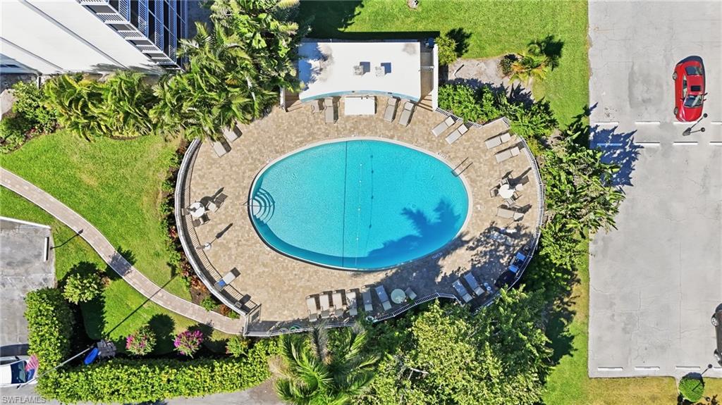 5 Bluebill Avenue, Unit 301 Naples, FL 34108 - Photo 39 of 48 an aerial view of a house with garden space and swimming pool
