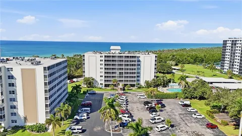 a view of a patio with table and chairs and potted plants