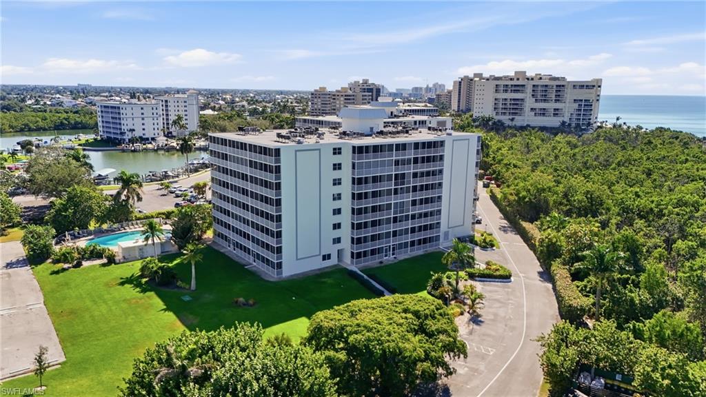 5 Bluebill Avenue, Unit 301 Naples, FL 34108 - Photo 44 of 48 a view of a city with tall buildings