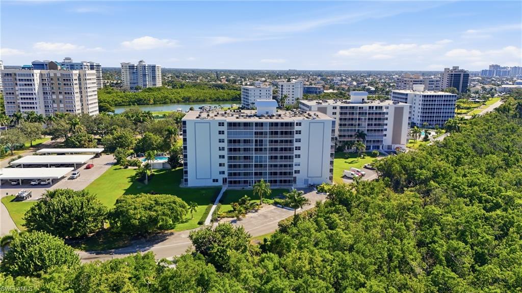 5 Bluebill Avenue, Unit 301 Naples, FL 34108 - Photo 45 of 48 a view of a city with tall buildings
